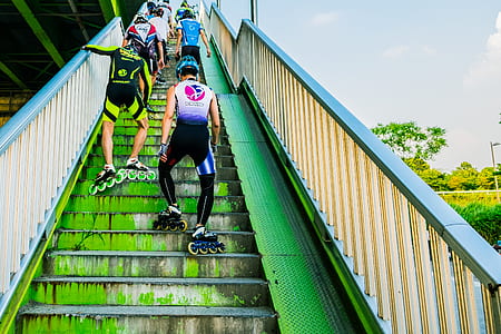 skaters going up stairs at daytime thumbnail
