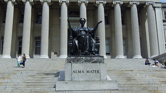 two person walking on stair near Alma Mater statue at daytime thumbnail