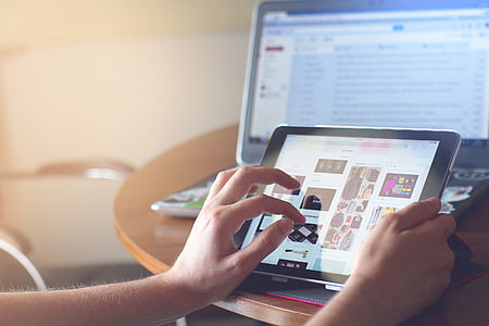 person holding tablet computer thumbnail
