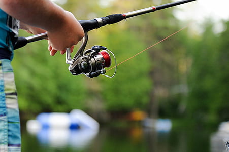 person holding fishing rod thumbnail