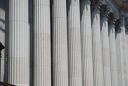 photo of gray post column building at daytime thumbnail
