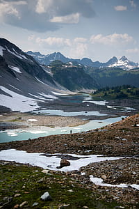 River Traveling Beside Gray Mountains thumbnail