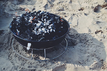 black fire pit on brown soil thumbnail