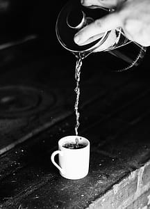 person spilling water in white mug thumbnail