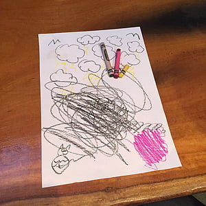 three assorted-color crayons on white printer paper thumbnail