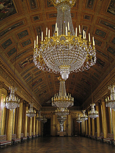 chandeliers hanging on ceiling inside building thumbnail