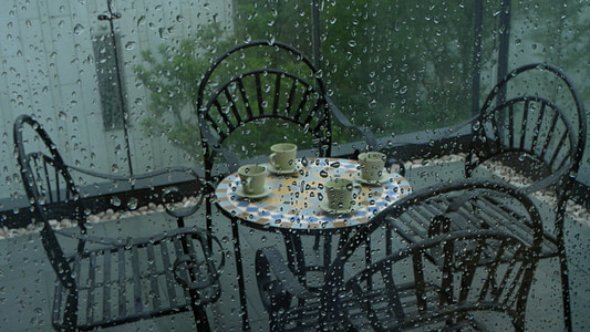 green mugs with saucers on round table thumbnail