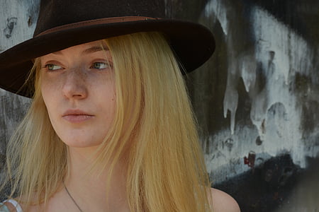 woman wearing hat and spaghetti strap top thumbnail