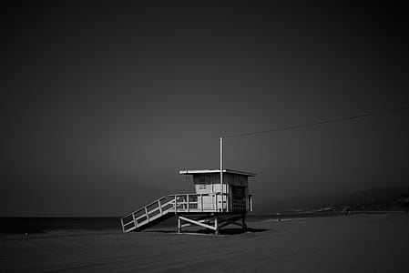 White Wooden Lifeguard House Near Shoreline thumbnail