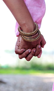 two persons holding hands thumbnail