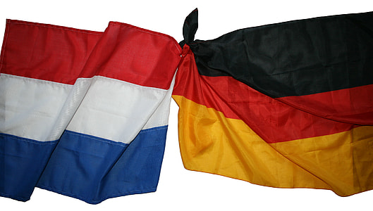 two flag ties on white surface thumbnail
