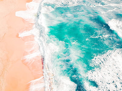 sea waves hitting seashore during daytime thumbnail