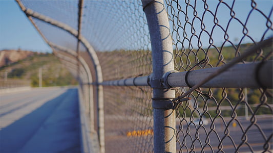 selective focus photography of gray fence thumbnail