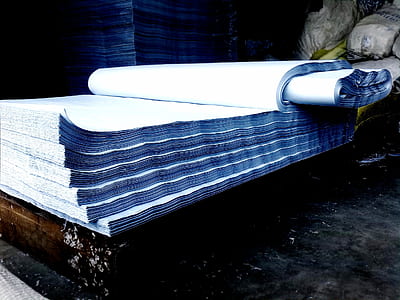 white printed paper placed on brown wooden slab thumbnail