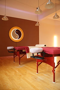 two red-and-white massage beds inside room thumbnail