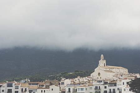 white cathedral under cloudy sky thumbnail