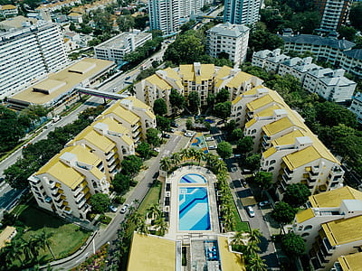 bird's-eye view photography of pool between houses thumbnail