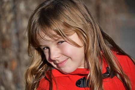 Blonde Girl Wearing Red Toggle Jacke thumbnail