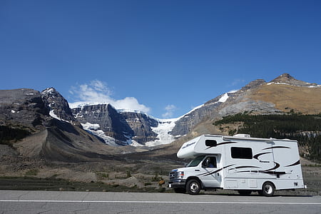 motorhome passing by mountain alps thumbnail