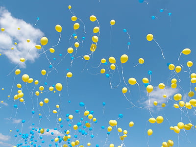 yellow balloons on the sky during daytime thumbnail