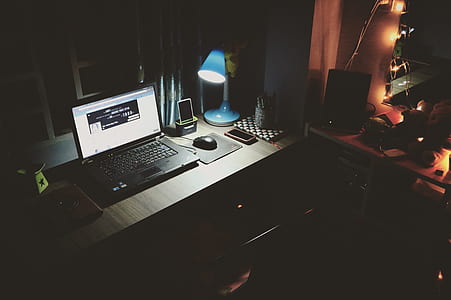 Black Laptop Beside Black Computer Mouse Inside Room thumbnail