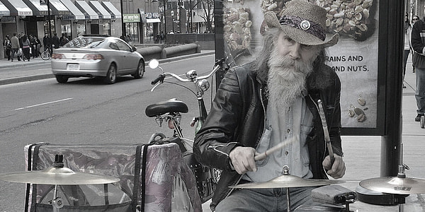 man playing drums near utility trike thumbnail