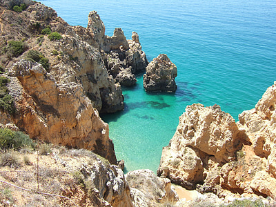 rocky coastline with green water thumbnail