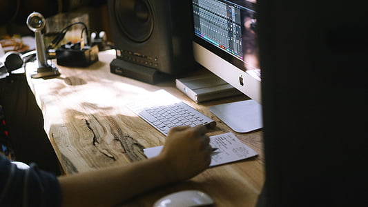 man using silver iMac during daytime thumbnail