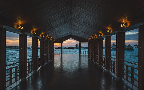 beach cottage near body of water thumbnail