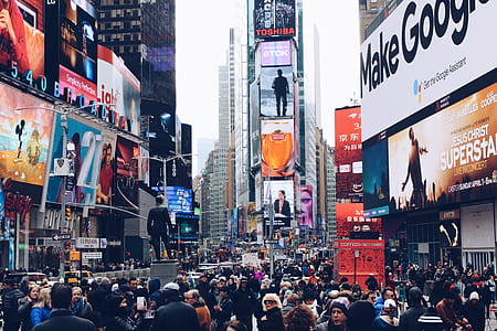 people walking on Time Square road during daytime thumbnail