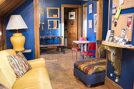 yellow leather sofa near yellow table lamp thumbnail