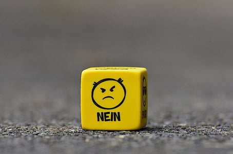 yellow dice on brown surface thumbnail