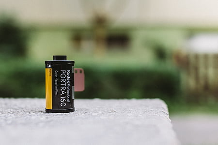 yellow and black Kodak Portra 160 film tube thumbnail
