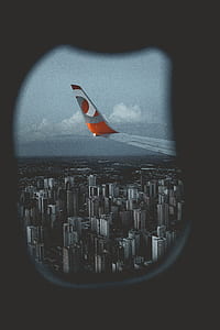 view of plane wing from window of plane thumbnail