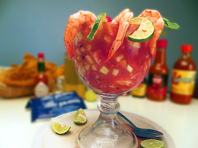 beverage in clear footed glass on table thumbnail