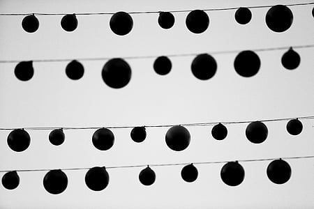 low angle photo of silhouette of round hanging decors thumbnail