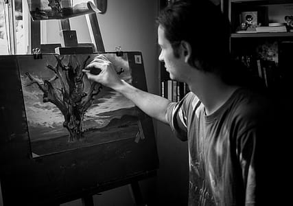 Grayscale Photography of Man Painting a Tree thumbnail