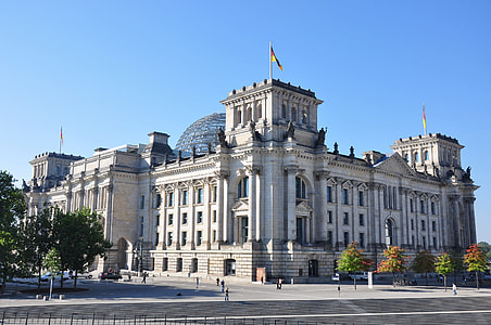white building with flags on tower thumbnail