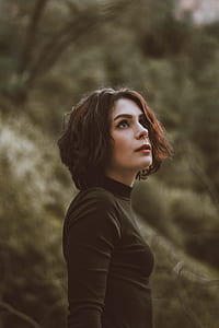 woman wearing black-gold crew-neck sweatshirt thumbnail