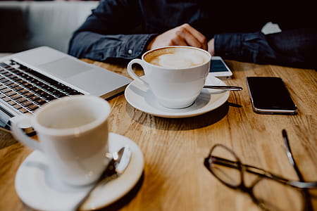 Cup of coffee on table in cafe thumbnail