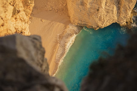 body of water surrounded by mountain cliff thumbnail