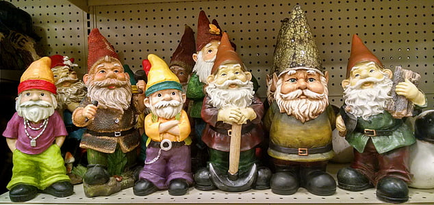 assorted-color gnome figurine lot on brown perforated board thumbnail