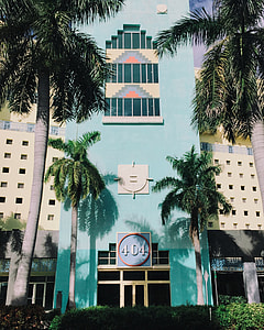 teal 404 bulding in front of yellow building thumbnail