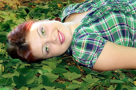 woman laying down on grass thumbnail