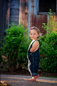 girl in blue denim dugaree pants photo thumbnail