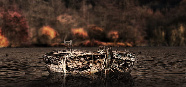 two brown canoes on river thumbnail