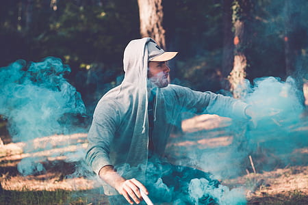 man smoking near forest thumbnail
