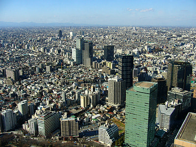 aerial view of cityscape under blue sky at daytime thumbnail