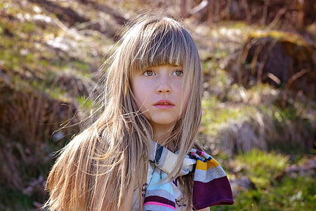 girl standing infront of grasses thumbnail