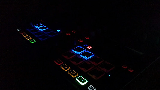 lights glowing on computer keyboard inside room thumbnail